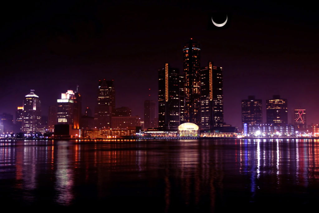 Detroit at night with moon 